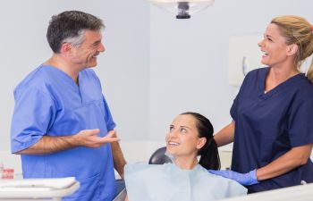 a woman in a dental chair during a dental appointment