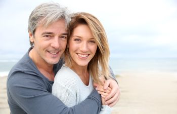 Cheerful mature couple with perfect smiles.