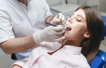 Young woman undergoing dental checkup.