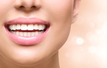 Woman showing perfect teeth in her smile.