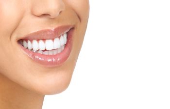 a woman with perfect smile after cosmetic dentistry treatment