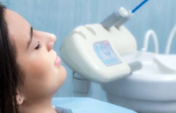 relaxed woman under sedation before dental procedure