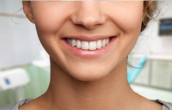 girl with a perfect smile after cosmetic dentistry treatment